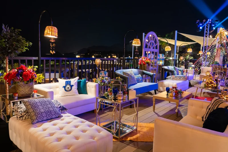 Outdoor lounge with beautiful furniture and lights.